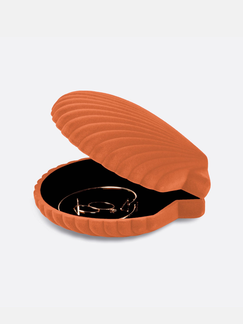 Boîte Venus orange ouverte, avec son intérieur sombre visible.